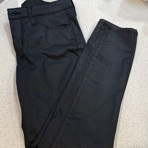 Black waxed look skinny jeans.